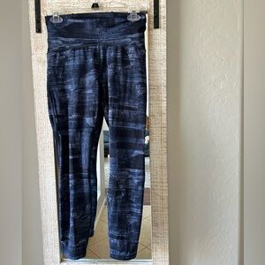 Blue LuluLemon leggings with sheer side panels.